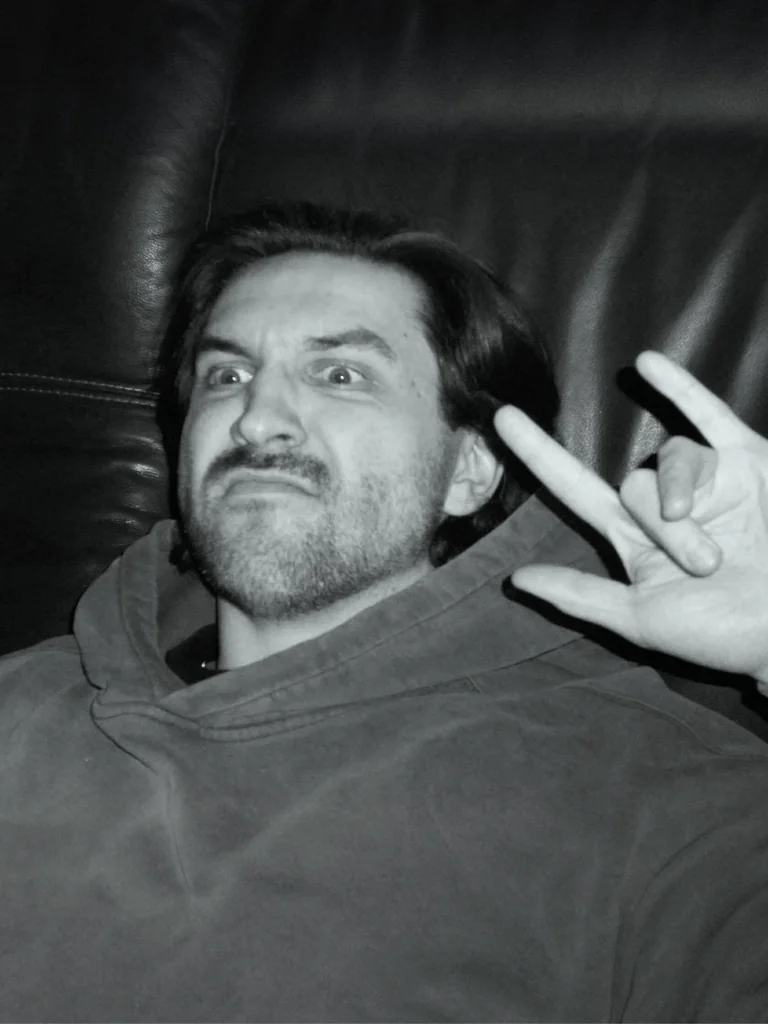 Filip pulling a face and throwing the horns